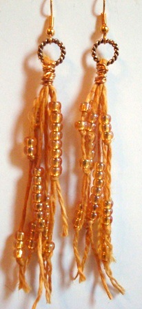 Golden jute cord with size 6 silver lined seed beads