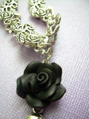Close up of black rose and links