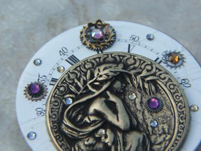Old handpainted porcelain watch face used at the base for this piece