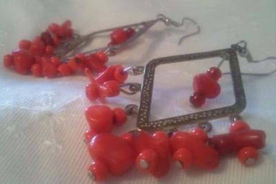 Branch red coral on shiny silver plated chandeliers