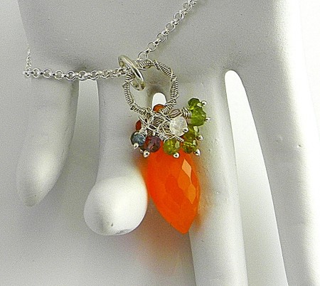 A few gemstone bead orphans left from the necklace and bracelet worked very well as a topper cluster for this sweet carnelian drop.