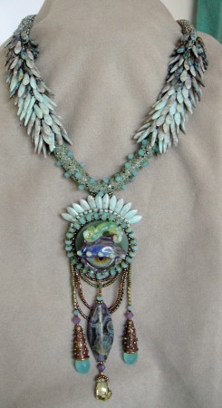 The ropes are done in a peyote tube and the daggers are added later.