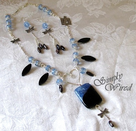 blue stones with silver dragon flies