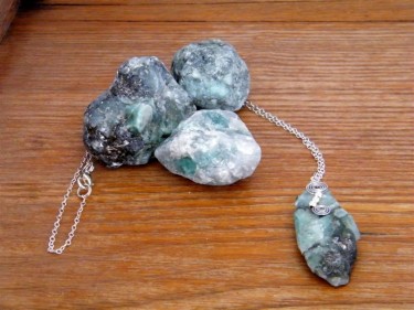 Raw Emerald Necklace on Wood