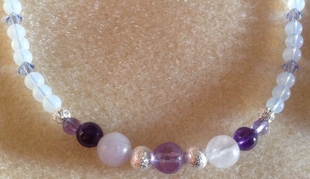 This is the front of the necklace. The sides and back were made with glass opal like beads and providence lavender Swarovski crystals