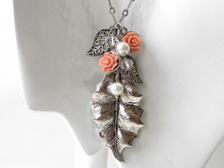 Metal leaf pendant with coral flowers