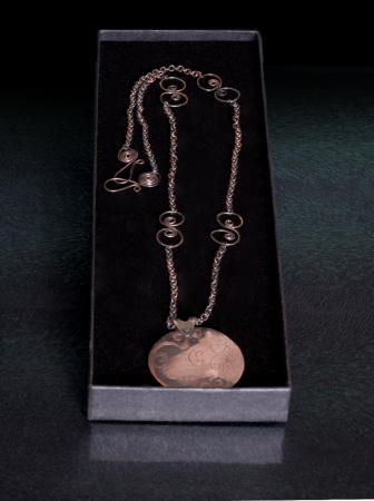 The necklace, showing off a little bit more of chain