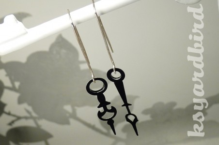 Half-past bling clock hand earrings
