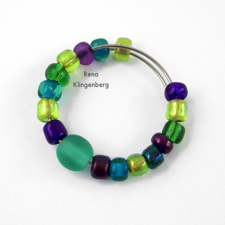 Finished beading on hoop earring for Memory Wire Pendant and Earrings - Tutorial by Rena Klingenberg
