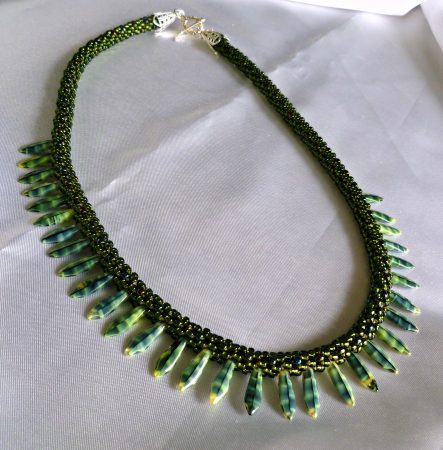 Forest green beaded Kumihimo dagger necklace by Anita Campbell - featured on Jewelry Making Journal