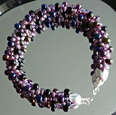Jewel tones beaded Kumihimo cuff/bangle bracelet by Anita Campbell - featured on Jewelry Making Journal