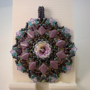 Woven pendant by Lisa Lavado - featured on Jewelry Making Journal